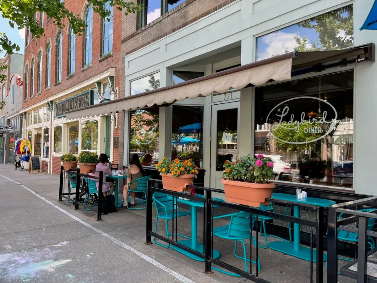 Sidewalk tables outside a diner on Massachusetts Street in downtown Lawrence, KS